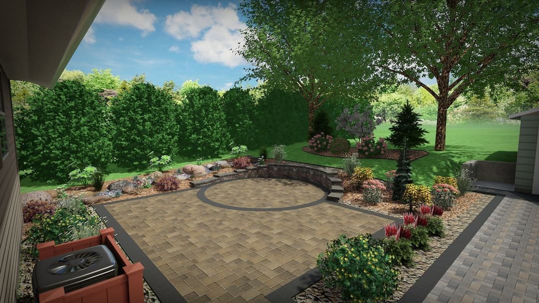 Beautiful landscaped garden with stone patio, shrubs, and trees under a blue sky.